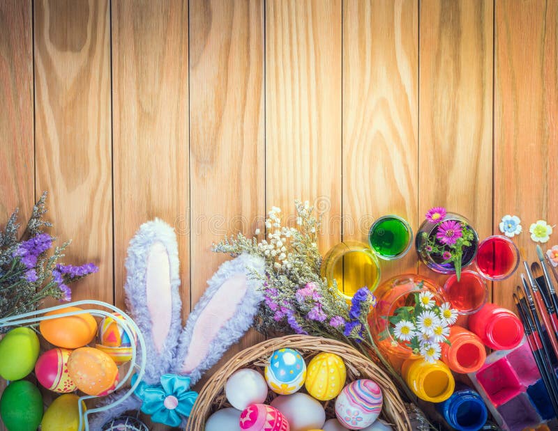 Happy Easter day colorful eggs and flower a set of food coloring, acrylic paintbrush for do it yourself on brown wooden floor with royalty free stock images