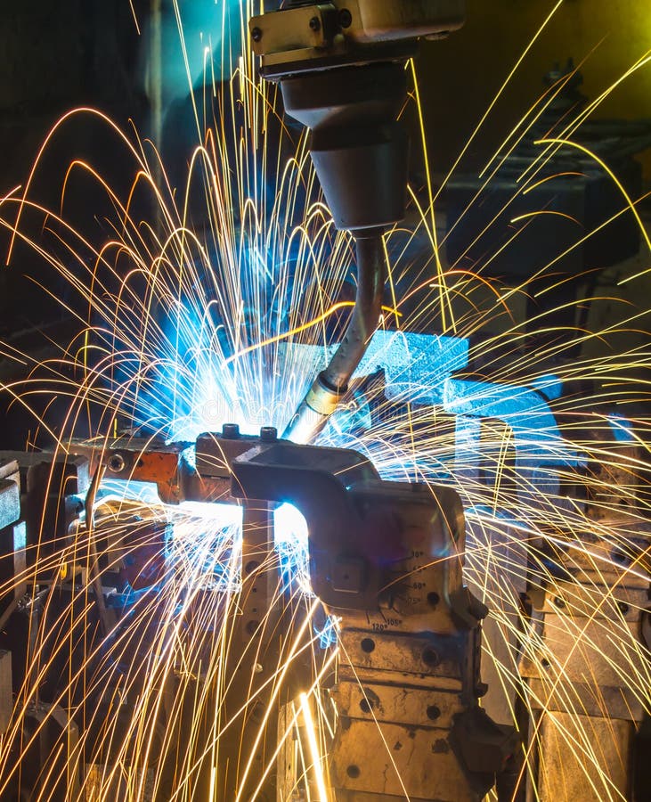 Robots welding automotive parts. Robot welding Industrial automotive part in factory royalty free stock photo