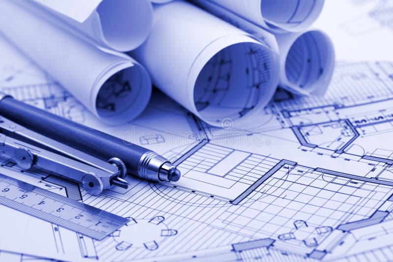 Rolls of architecture blueprint & work tools. Ruler, pencil, compass royalty free stock photo