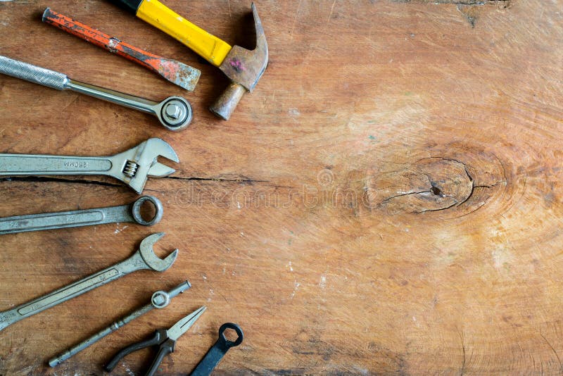 Set of work tools on old grunge wood background. With copy space royalty free stock photo