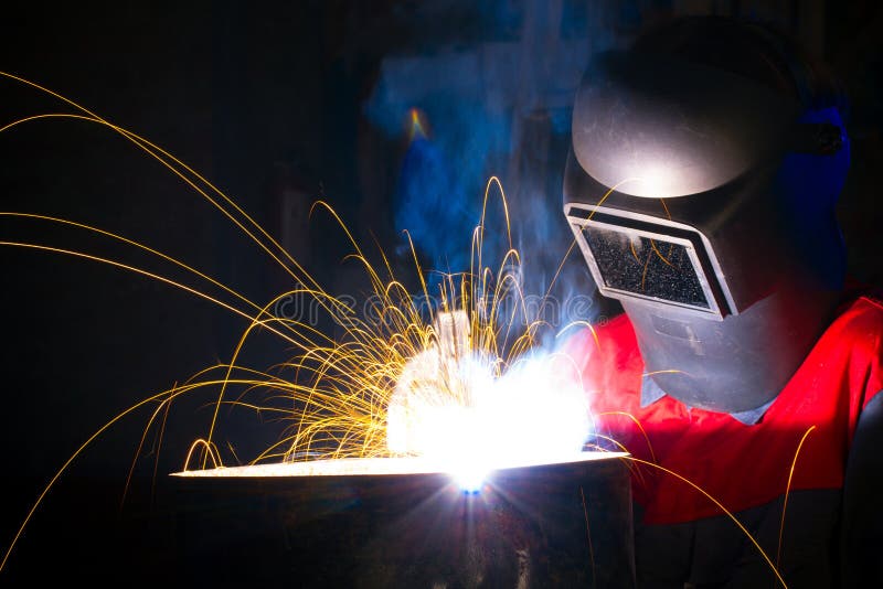 Sparks and smoke while welding. Iron stock photo