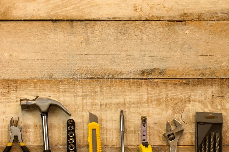 Work tools. Assorted work tools on wood with free space for text stock photo