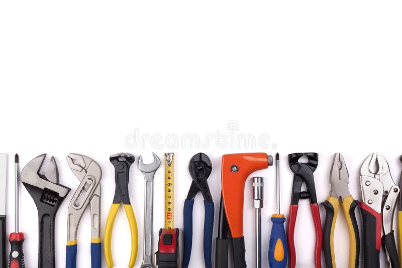 Work tools on white background. Work tools lined up in a straight line on white background royalty free stock photo